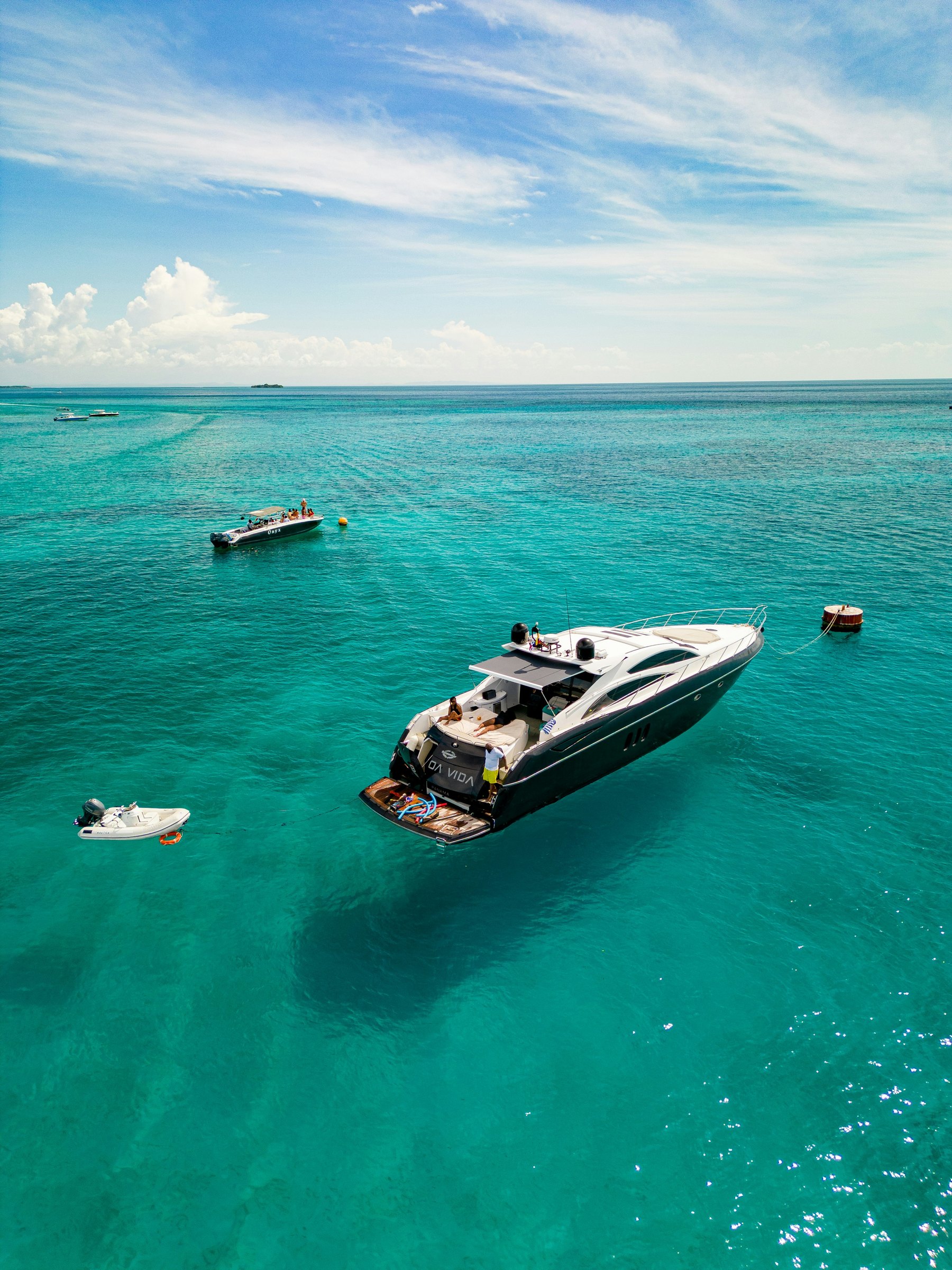 Luxury power yacht cruising in clear blue water